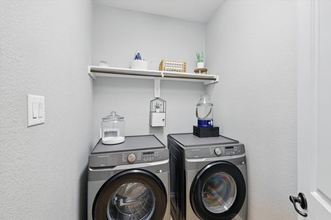Clothes washing area with independent washer and dryer and laundry area | Image 16