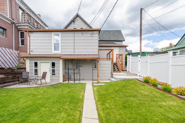 Rear view of house with a patio and roof with shingles | Image 26