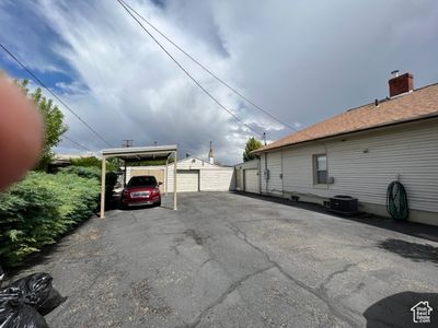 View of car parking with a carport | Image 3