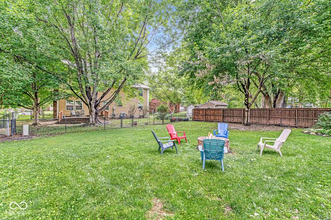 fenced backyard with a fire pit | Image 30