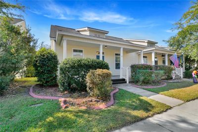 View of front of house featuring covered porch and a front yard | Image 2