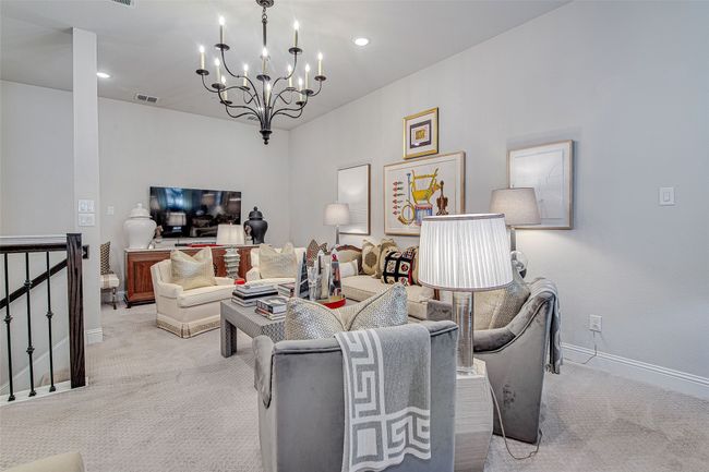 Living room featuring visible vents, baseboards, an inviting chandelier, carpet floors, and recessed lighting | Image 23