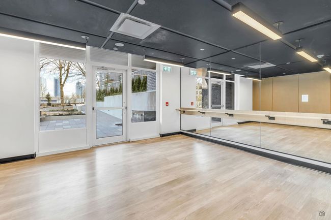 Rec room with wood finished floors and baseboards | Image 21