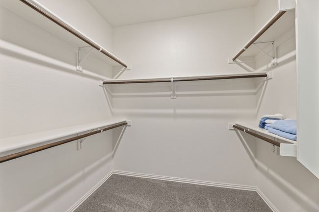 Spacious closet with carpet | Image 19