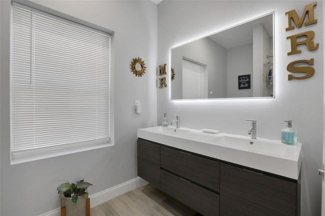 Bathroom featuring double vanity | Image 16