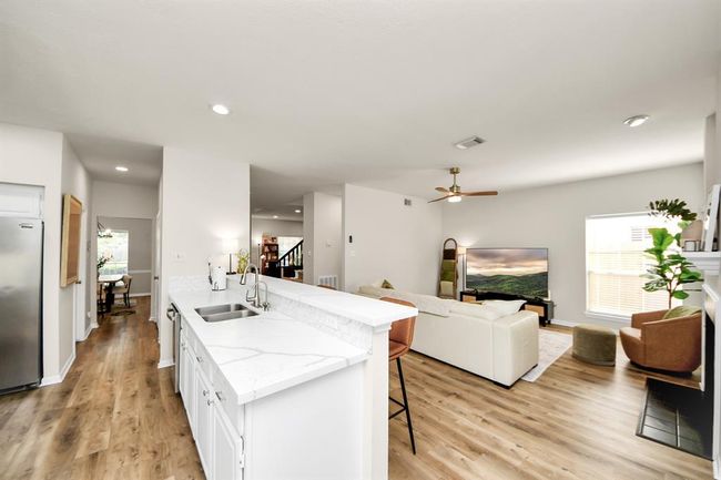 Looking from the kitchen toward the family room, you get a true sense of the open, connected layout that’s perfect for both everyday living and entertaining. | Image 16