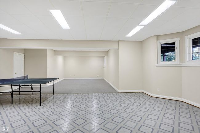 Basement game area looking to Family room area | Image 58