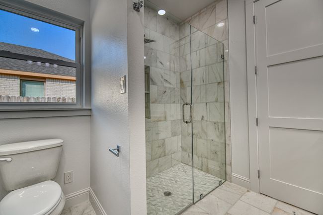 Bathroom featuring toilet and walk in shower | Image 27