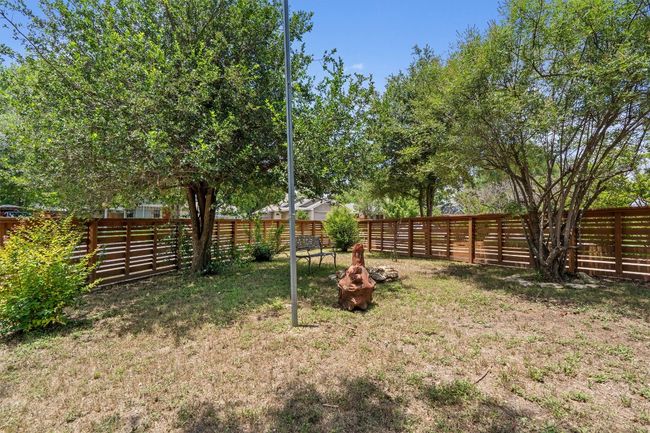 View of fenced backyard | Image 28