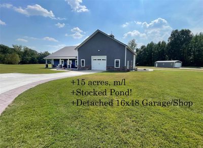 View of side of home with a lawn | Image 1