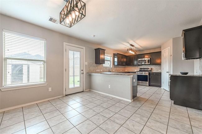 Dining/Breakfast area open to the kitchen & family room | Image 6