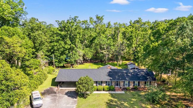 View of subject property with a heavily wooded area | Image 23