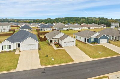 Prettiest house on the block. The large covered front patio and additional lush landscaping provides special curb appeal - and just wait until you see the back patio! | Image 3