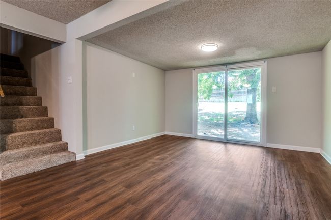 Living room leading to the spacious backyard. | Image 14