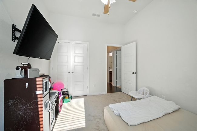 Bedroom with carpet, a closet, and a ceiling fan | Image 27