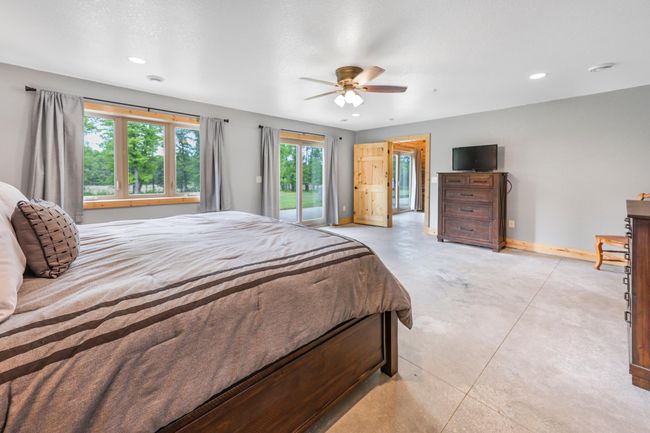 Primary Suite has sliding glass doors leading to 68X12 patio | Image 19
