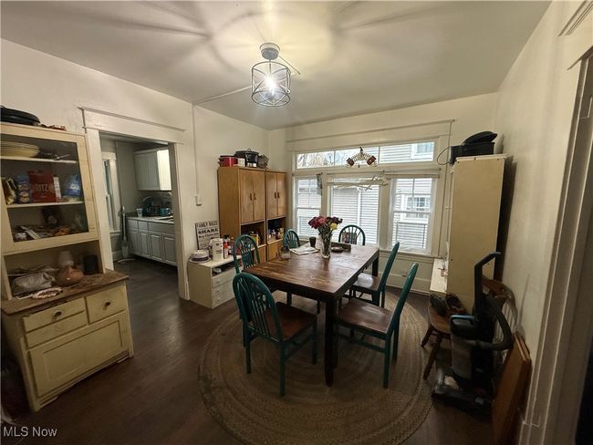 Dining area featuring dark wood finished floors | Image 15