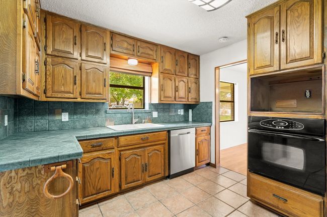 Kitchen looks out into front yard | Image 10