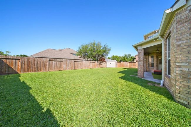 The fenced backyard offers plenty of space for child and/or pet play areas! | Image 44