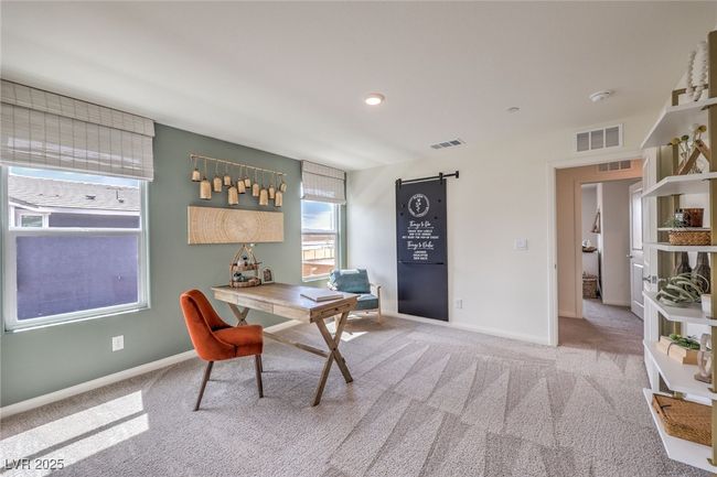 Photo is representational only; actual home finishes may vary. Carpeted home office featuring baseboards | Image 34