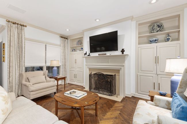 Family room features fireplace, built in and hardwoods | Image 11