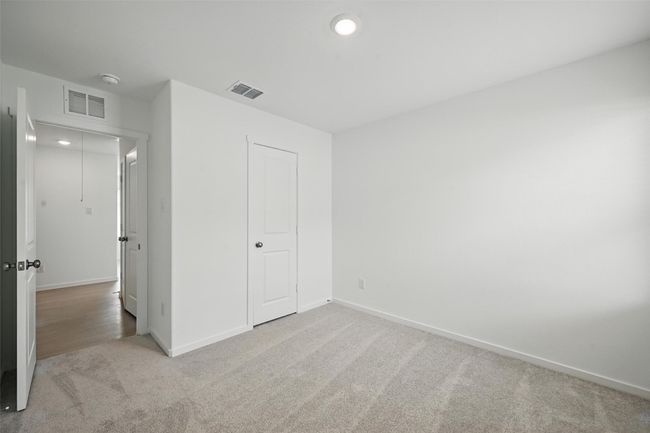 Unfurnished bedroom featuring carpet floors and baseboards | Image 15