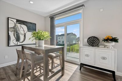 (Photo of a decorated model, actual features will vary) Soaked in natural sunlight, the homes eat-in dining room has ample space for a dining table located in the heart of the home. | Image 3