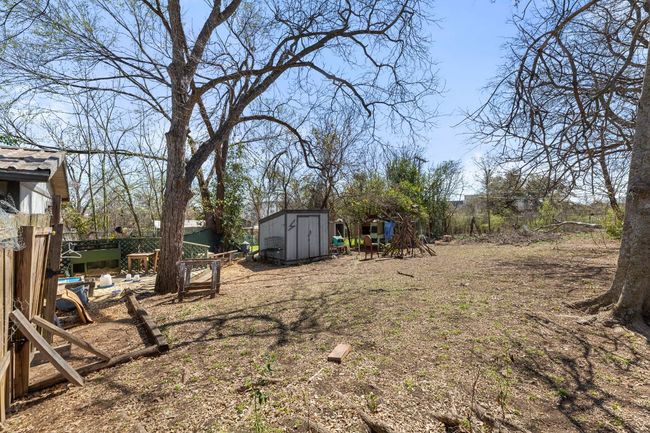 View of yard with an outbuilding and a storage shed | Image 19