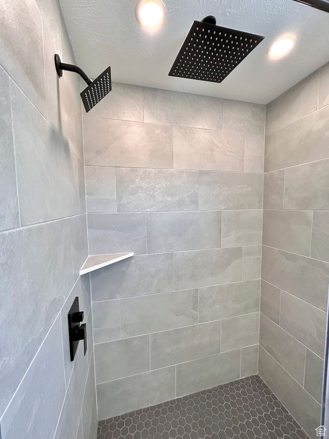 Bathroom with recessed lighting and tiled shower | Image 10