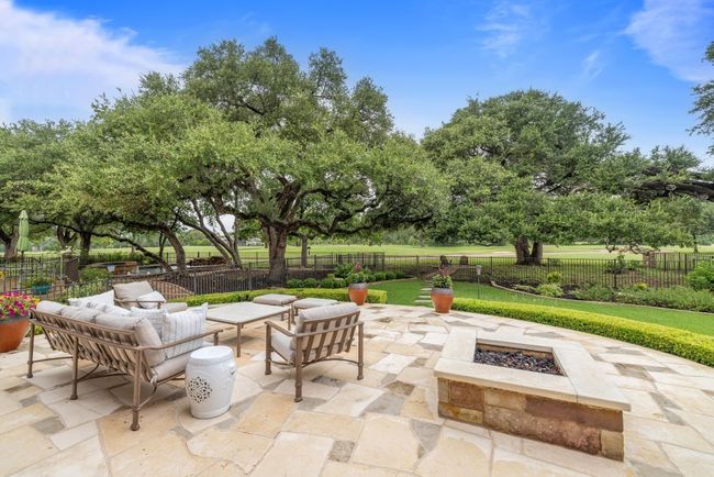 View of patio featuring an outdoor living space with a fire pit | Image 31