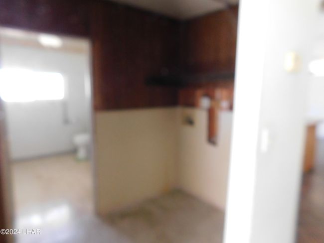 Laundry room leading to bathroom | Image 34
