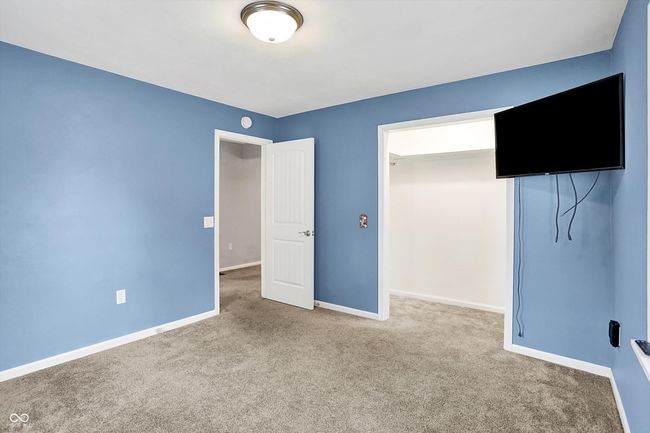 unfurnished bedroom with carpet and baseboards | Image 19