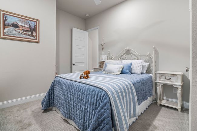 Bedroom featuring baseboards, carpet floors, and ceiling fan | Image 19