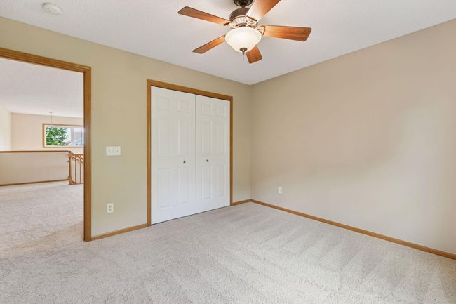 This room is also accentuated with raised panel doors and a ceiling fan | Image 18