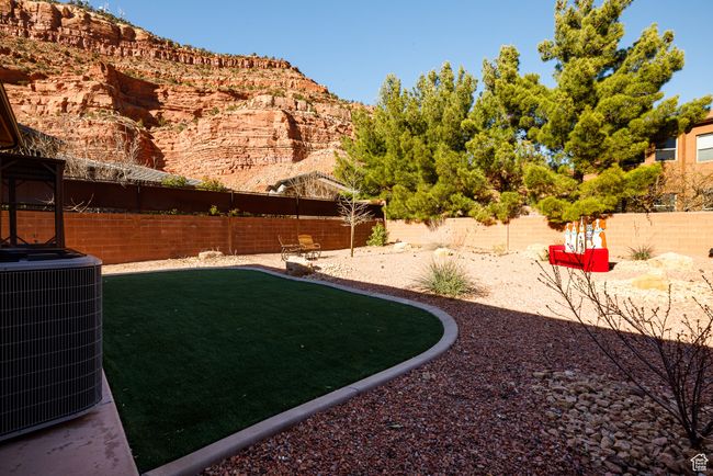 View of yard with a fenced backyard and central air condition unit | Image 39
