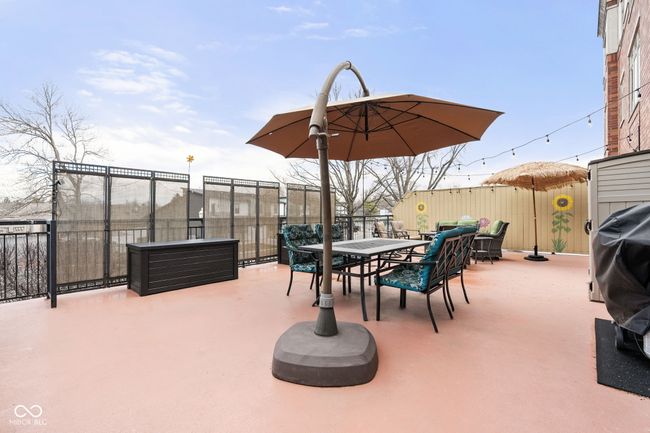 Step out of the sliding door onto the deck adorned with privacy panels | Image 27