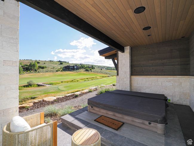 View of patio with a covered hot tub and golf course view | Image 15