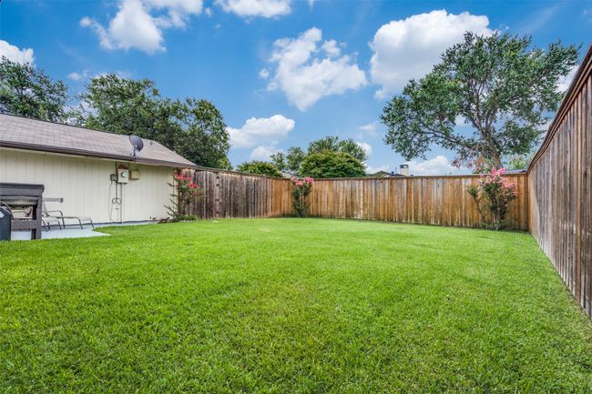 View of fenced backyard | Image 22