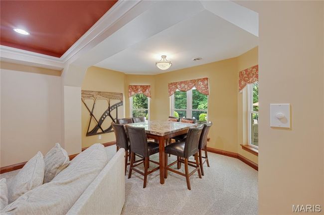 Dining area with light carpet and baseboards | Image 47