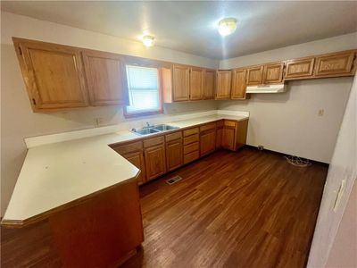 Kitchen featuring sink and dark wood-type flooring | Image 3