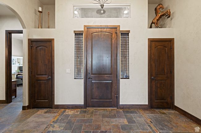 Foyer entrance featuring stone tile floors and arched walkways | Image 45