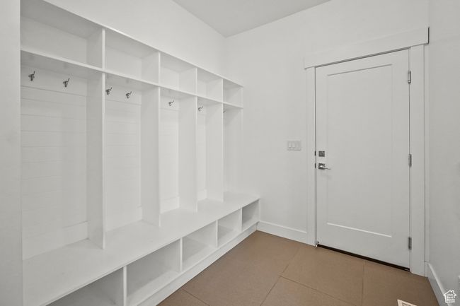 Mudroom featuring tile patterned floors and baseboards | Image 7