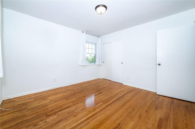 bedroom featuring hardwood | Image 12