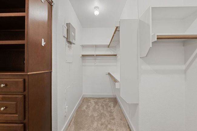 Walk in closet featuring carpet | Image 35