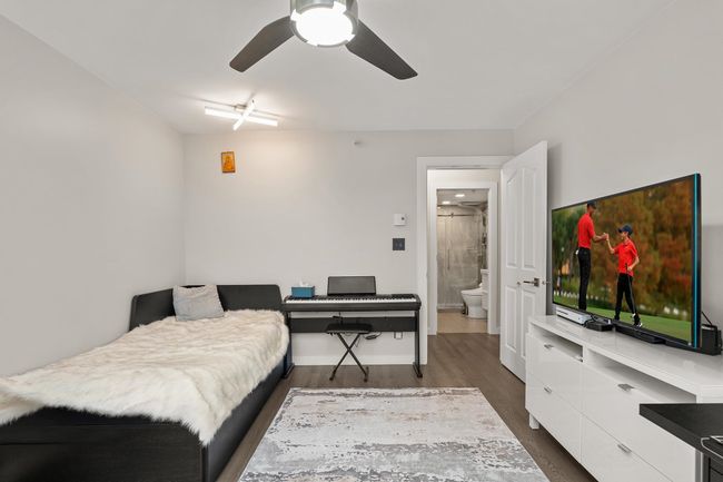 Bedroom featuring baseboards, ceiling fan, and wood finished floors | Image 27