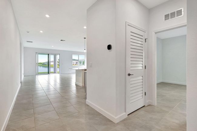 Entry foyer, hallway to laundry | Image 48
