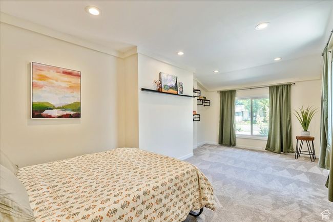 Bedroom featuring carpet flooring, recessed lighting, and lofted ceiling | Image 31