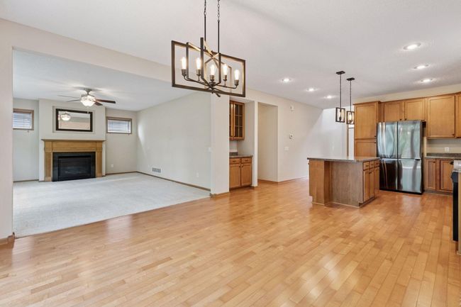 The main level has an open floor plan with nine foot ceilings and hardwood floors | Image 7