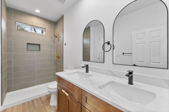Bathroom with tiled shower, double vanity | Image 17