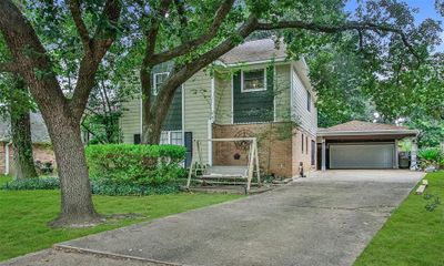 Pull into your 2 car garage or just stop under the double carport. Unload things right into the kitchen or expansive backyard area with your pool. | Image 2